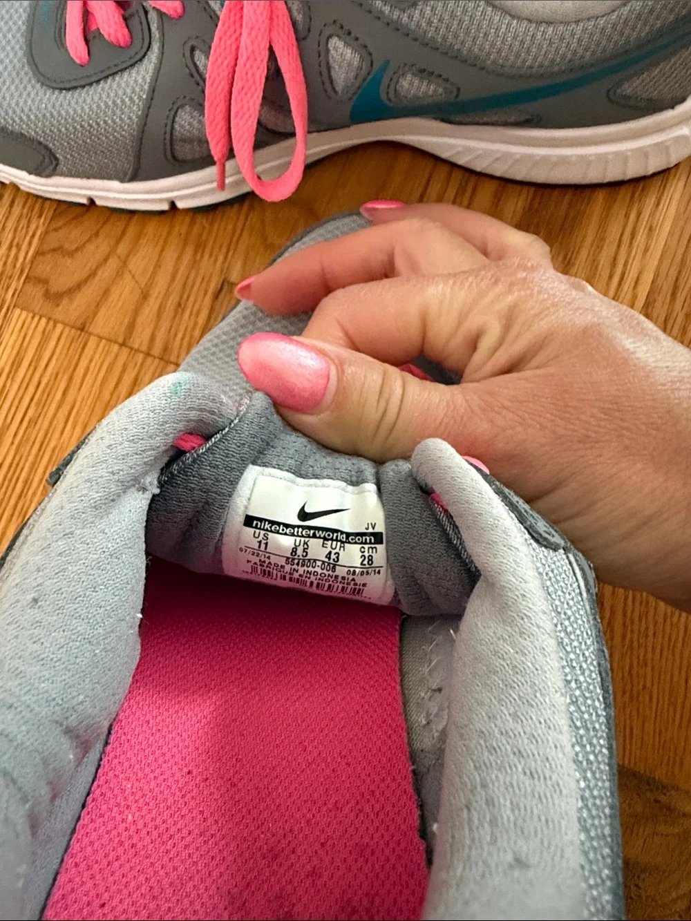 Nike Women's Gray Athletic Sneakers with Pink Laces and Blue Swoosh